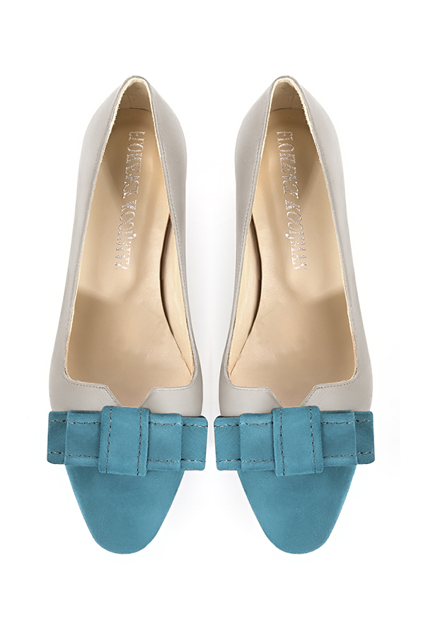 French elegance and refinement for these peacock blue and pearl grey dress pumps, with a knot on the front, 
                available in many subtle leather and colour combinations. Possibility to customize with your colors, materials and heels.
With its original cutout, this pretty fitted pump
will render you great services, combining comfort and distinction. 
                Matching clutches for parties, ceremonies and weddings.   
                You can customize these shoes to perfectly match your tastes or needs, and have a unique model.  
                Choice of leathers, colours, knots and heels. 
                Wide range of materials and shades carefully chosen.  
                Rich collection of flat, low, mid and high heels.  
                Small and large shoe sizes - Florence KOOIJMAN